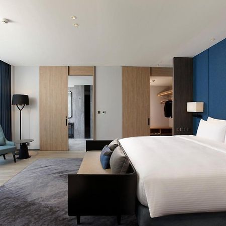 Hotel Cozzi Blu Zhongli Zewnętrze zdjęcie A bedroom at the hotel